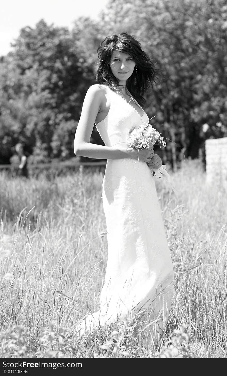 The bride with flowers in the park