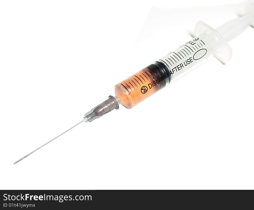 Filled syringe on white background. Filled syringe on white background.