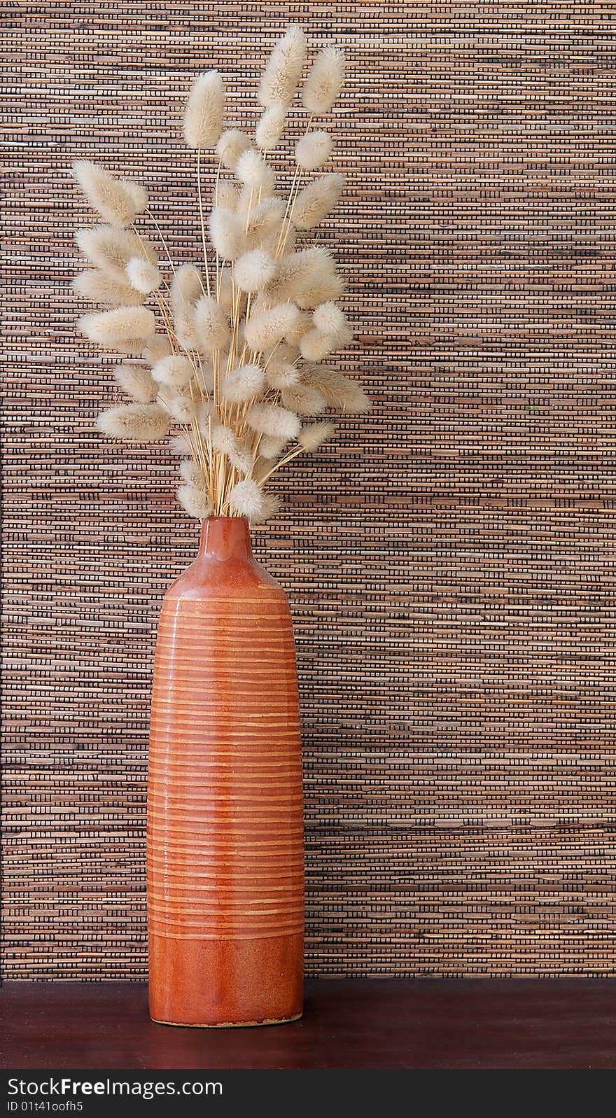 Beautiful ikebana on wooden table