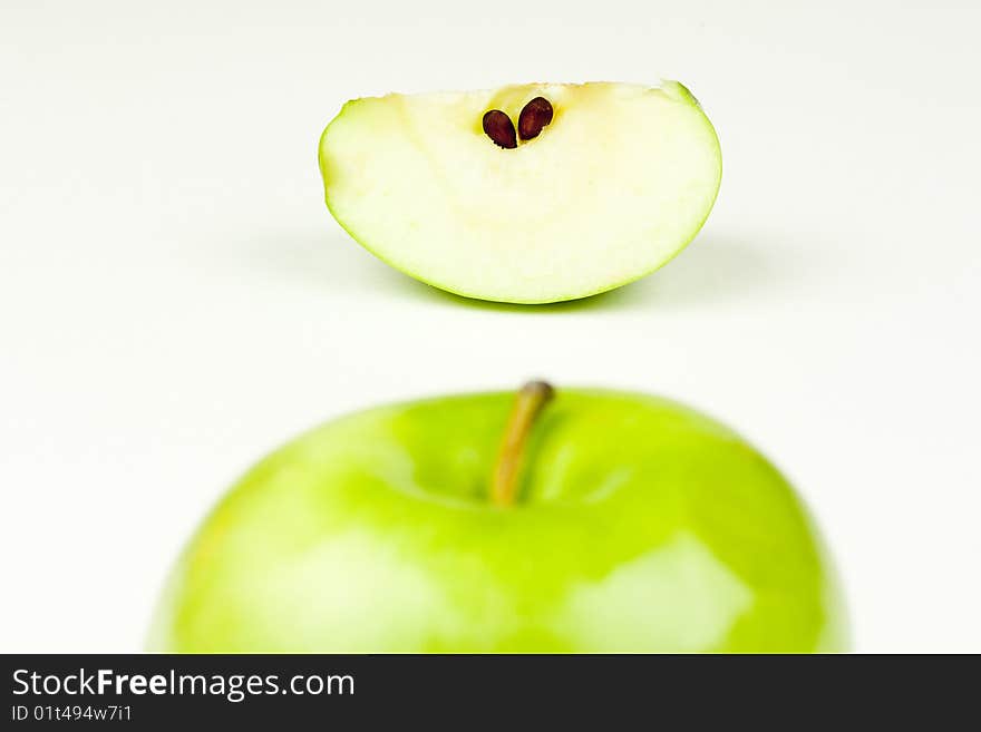 An apple top and apple slice. An apple top and apple slice