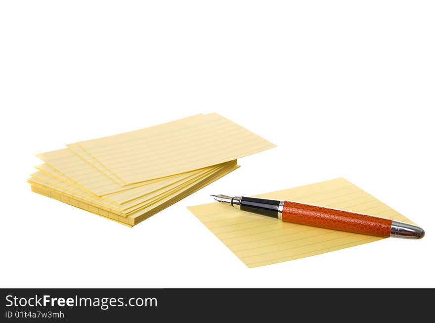 Notes block and pen isolated on a white background