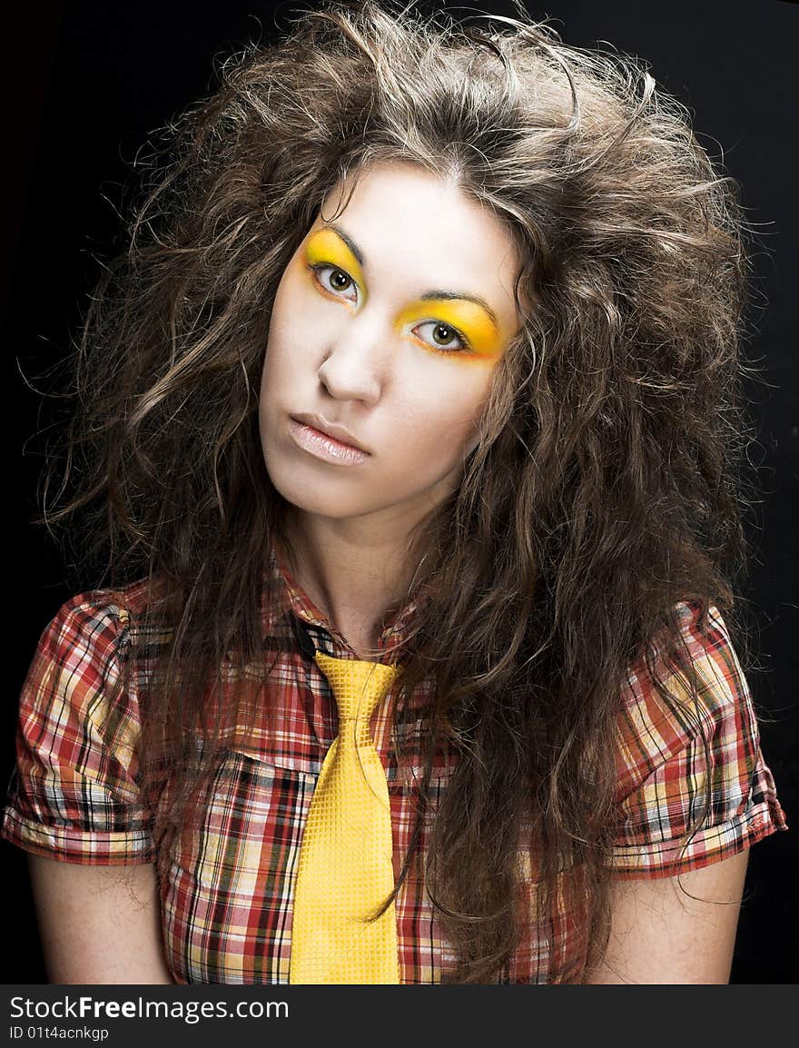 Romantic portrait of young woman wiht long curly hair