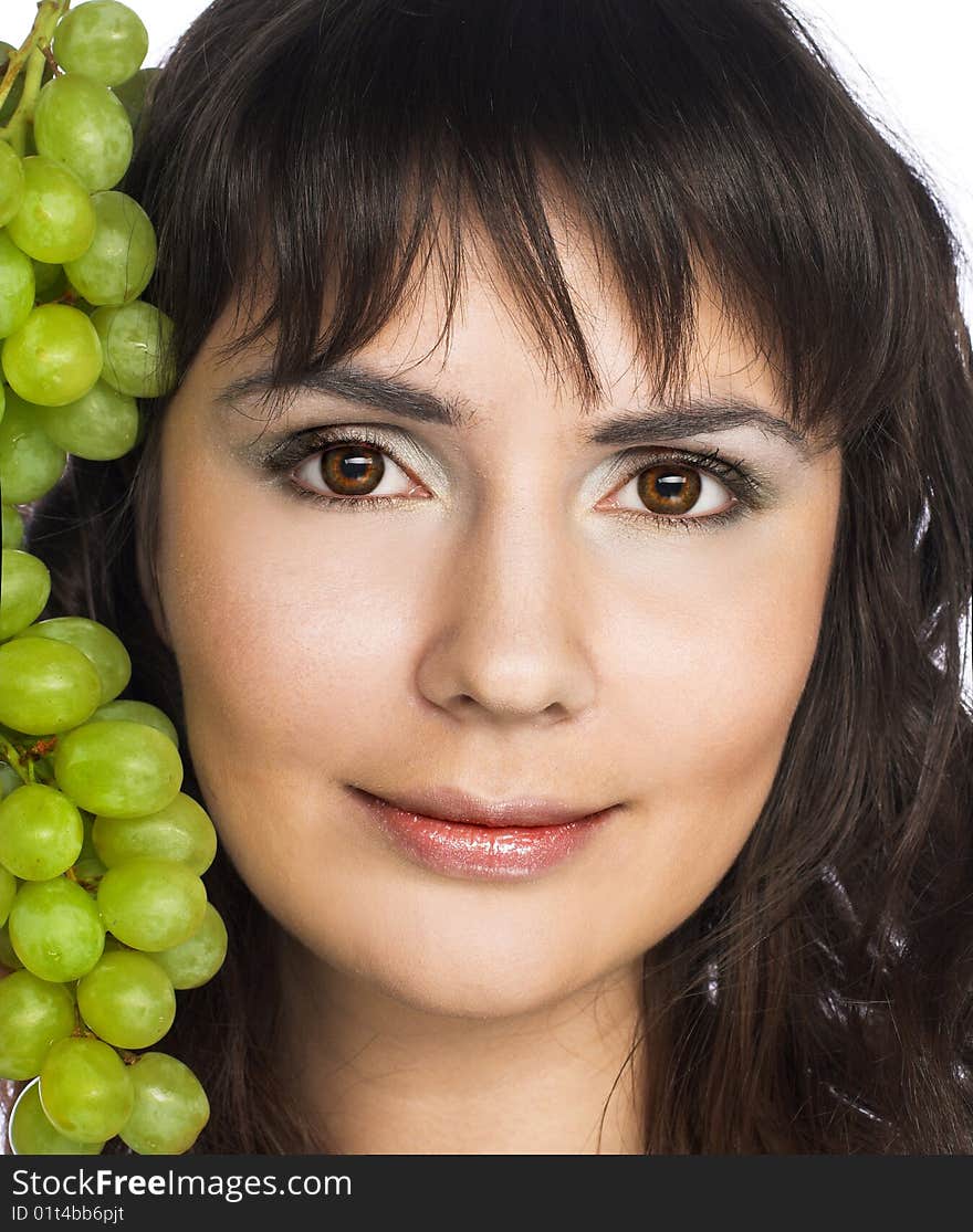 Portrait of young woman with green grapes. Portrait of young woman with green grapes