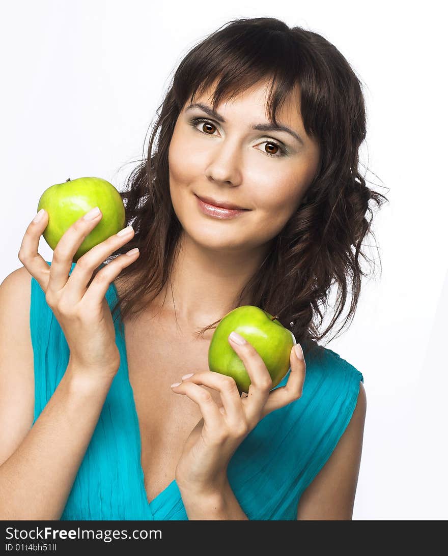 Portrait of young pretty woman with apple