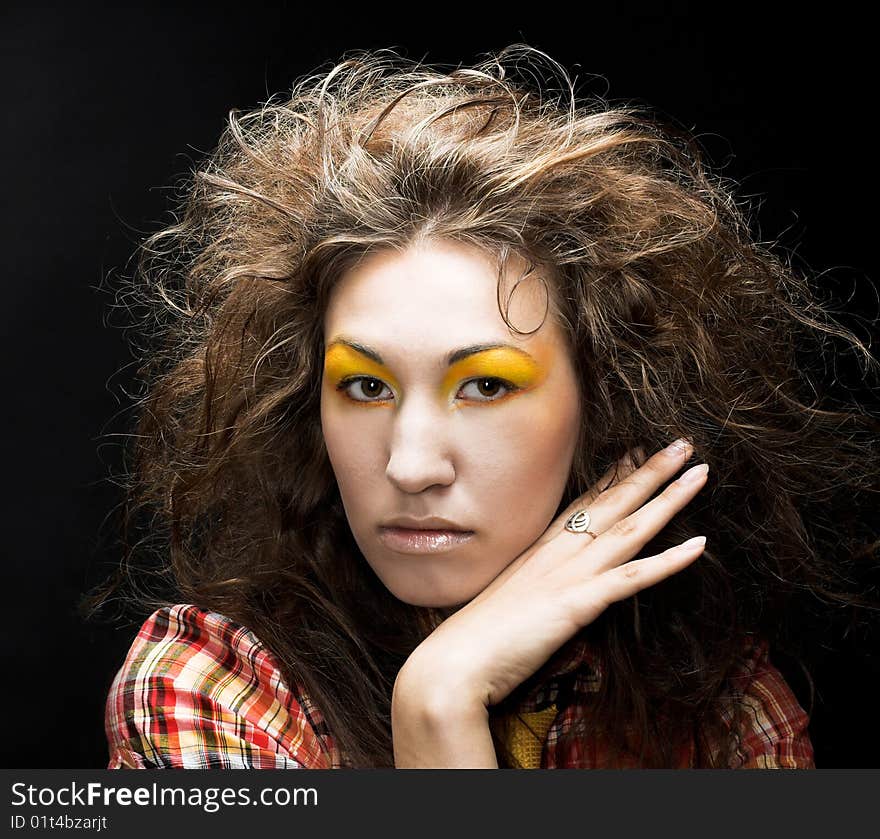 Romantic portrait of young woman wiht long curly hair