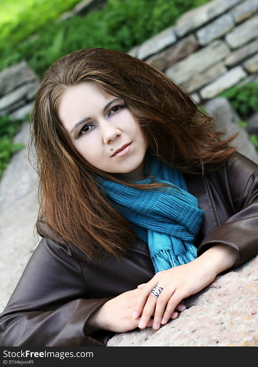 Portrait of young woman in blue scarf