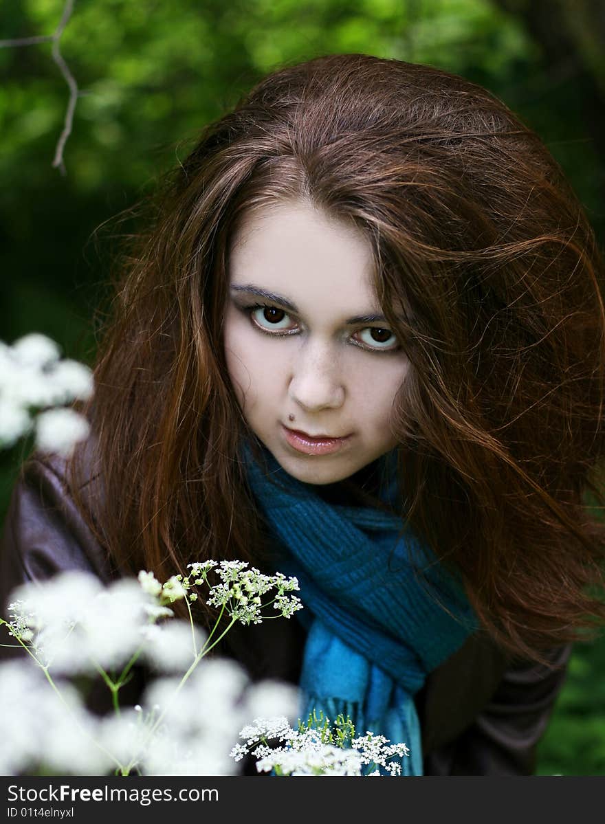 Portrait of young woman in blue scarf