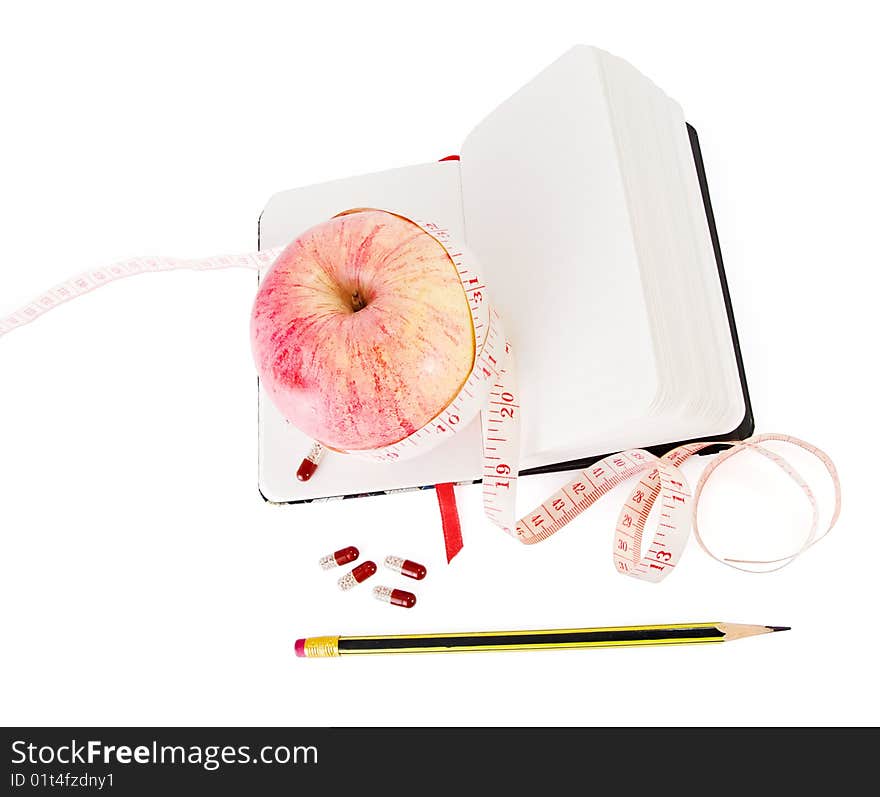 Diary With Apple And Pills For Effective Dieting