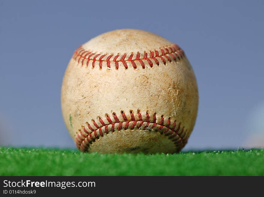 Baseball on Green Grass