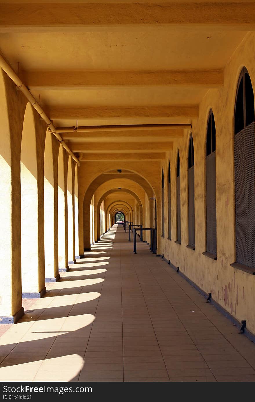 Historic (1923) arched walkway is part of the navy barracks at the old Naval Training Center in San Diego, now part of Liberty Station. The Spanish Colonial Revival style with open-air porches and arches is being preserved. Historic (1923) arched walkway is part of the navy barracks at the old Naval Training Center in San Diego, now part of Liberty Station. The Spanish Colonial Revival style with open-air porches and arches is being preserved.