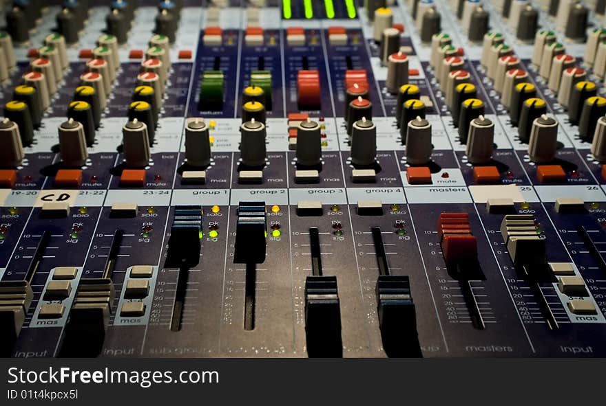 Sound producer mixer. Faders of channels and regulators. Close-up