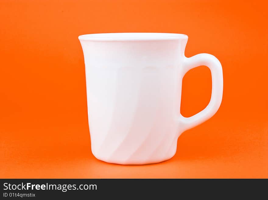 Your morning breakfast mug. Isolated on orange background