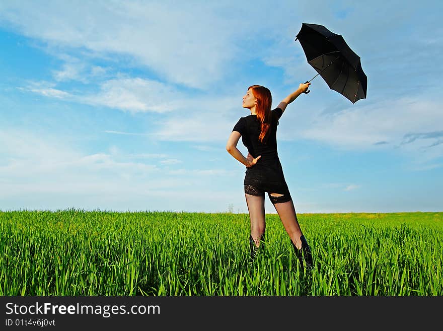 Business-kontsept on the nature with an umbrella