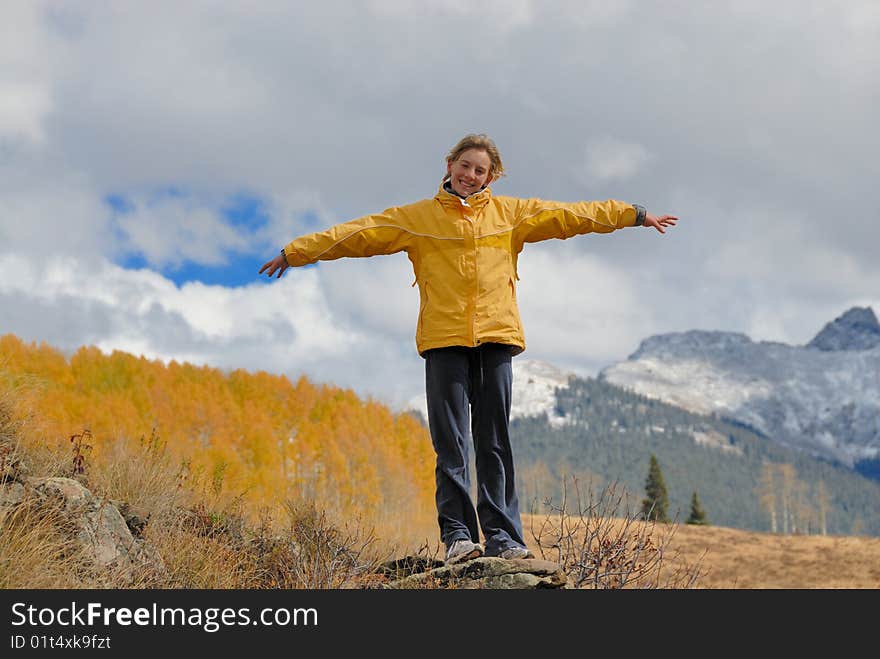 Girl stands alone in high mountain. Girl stands alone in high mountain