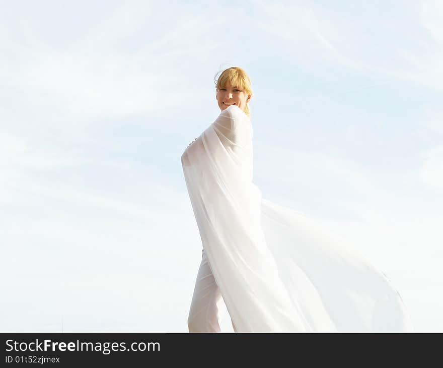 Session of a relaxation on a background of the years sky of the girl in white