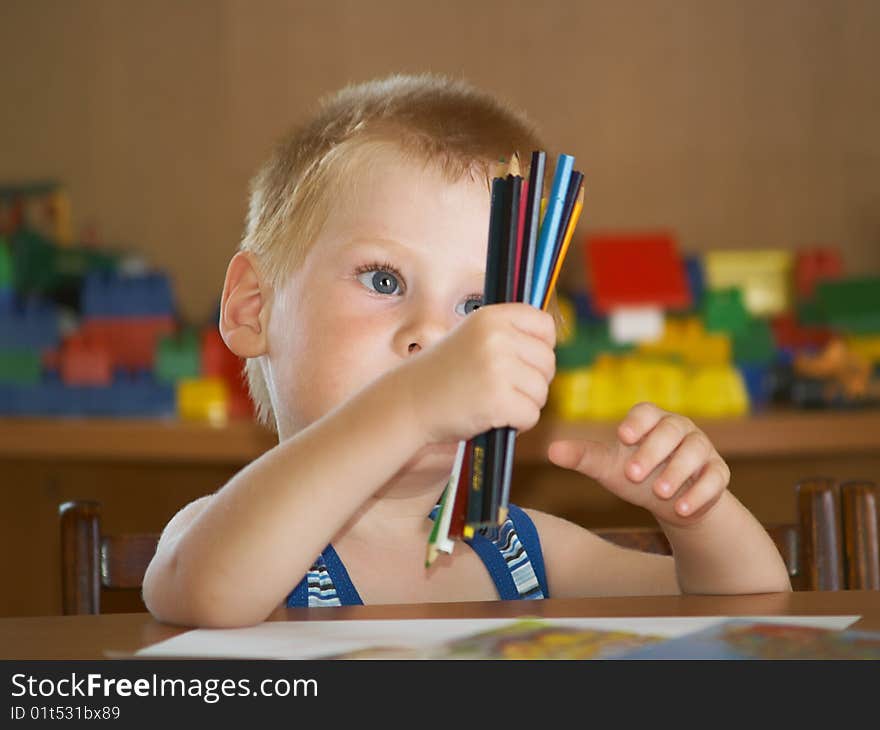 The boy of 2 years is engaged in a children's room