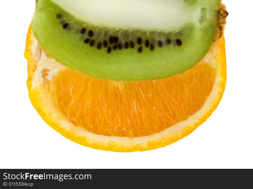 Fresh orange and kiwi isolated on white background. With focus on orange.