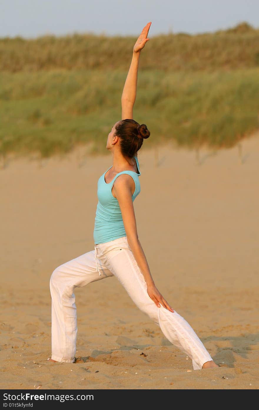 Yoga by sunset on the beach