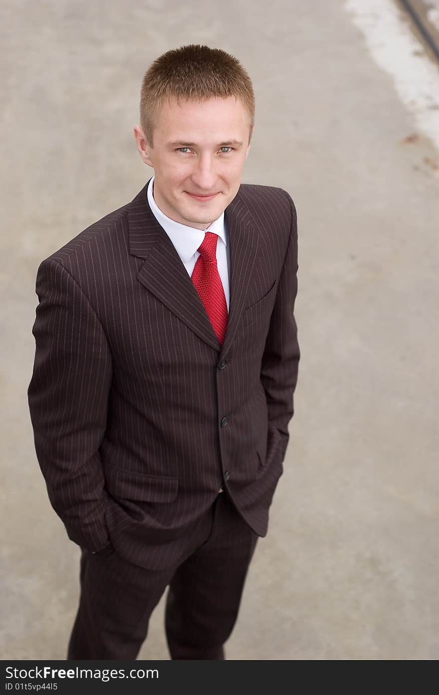 Portrait of a happy young businessman, smiling