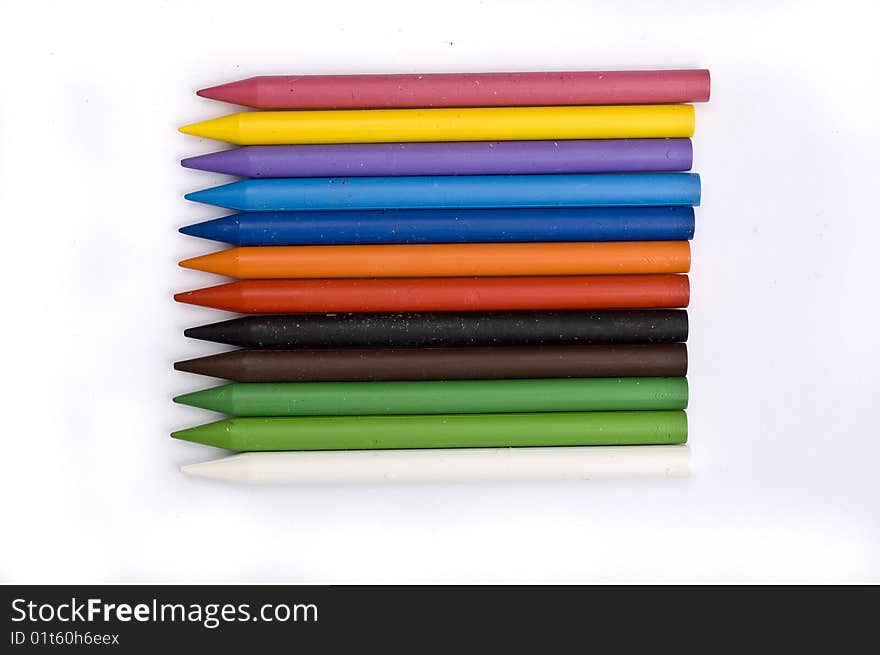 Arrangement of many colorful wax crayons