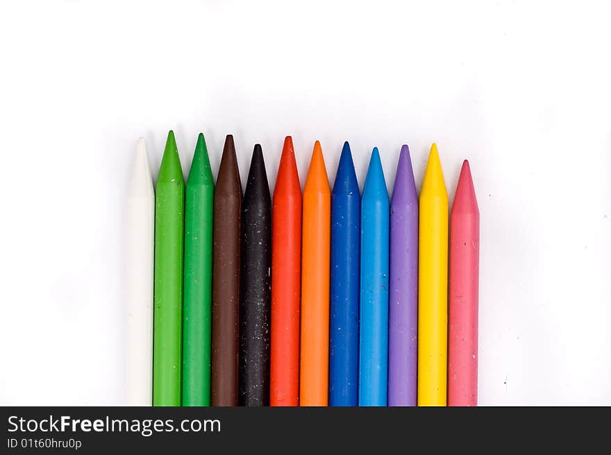 Arrangement of many colorful wax crayons