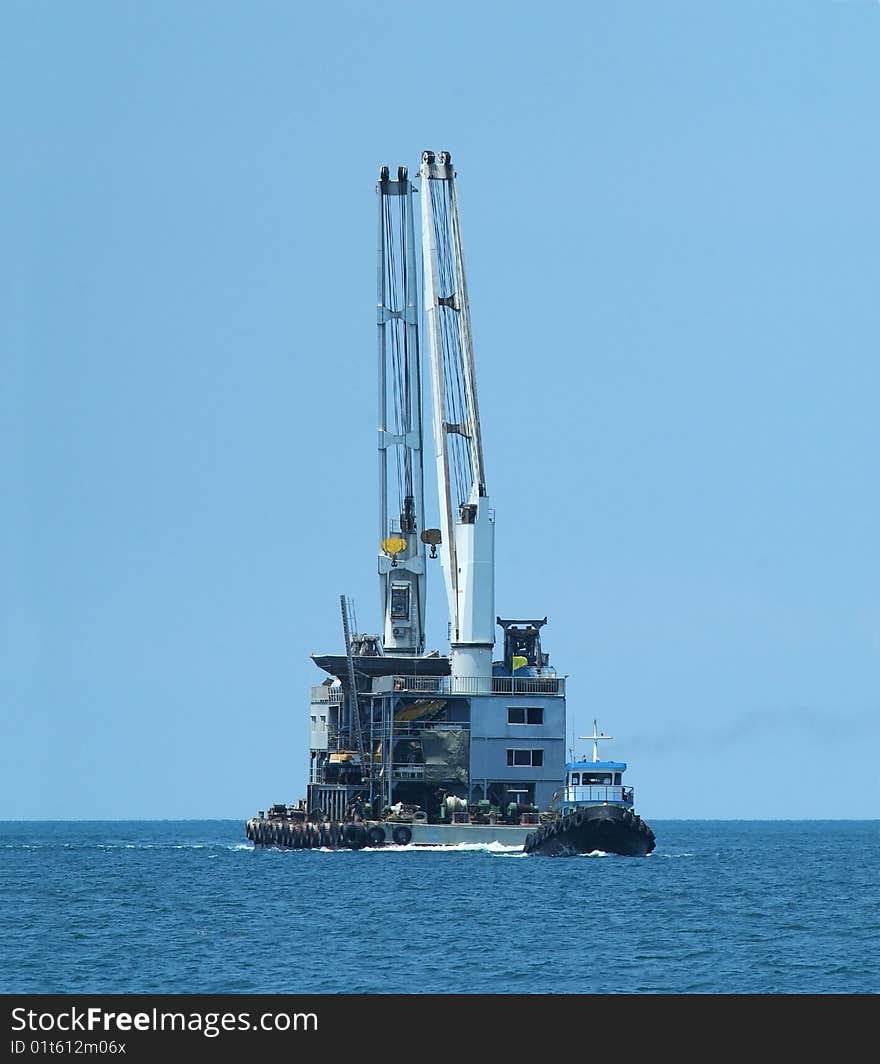 Tugboat and floating cranes