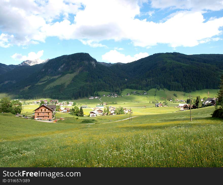 A beautiful village with green meadow. Shooting in Gosau village of Austria.