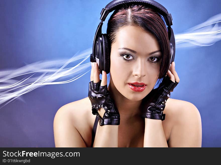 Girl listening to music over a  blue moving background