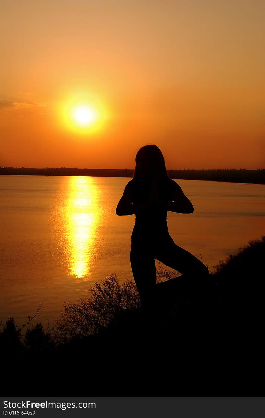 Girl doing exercises on the beach. Girl doing exercises on the beach