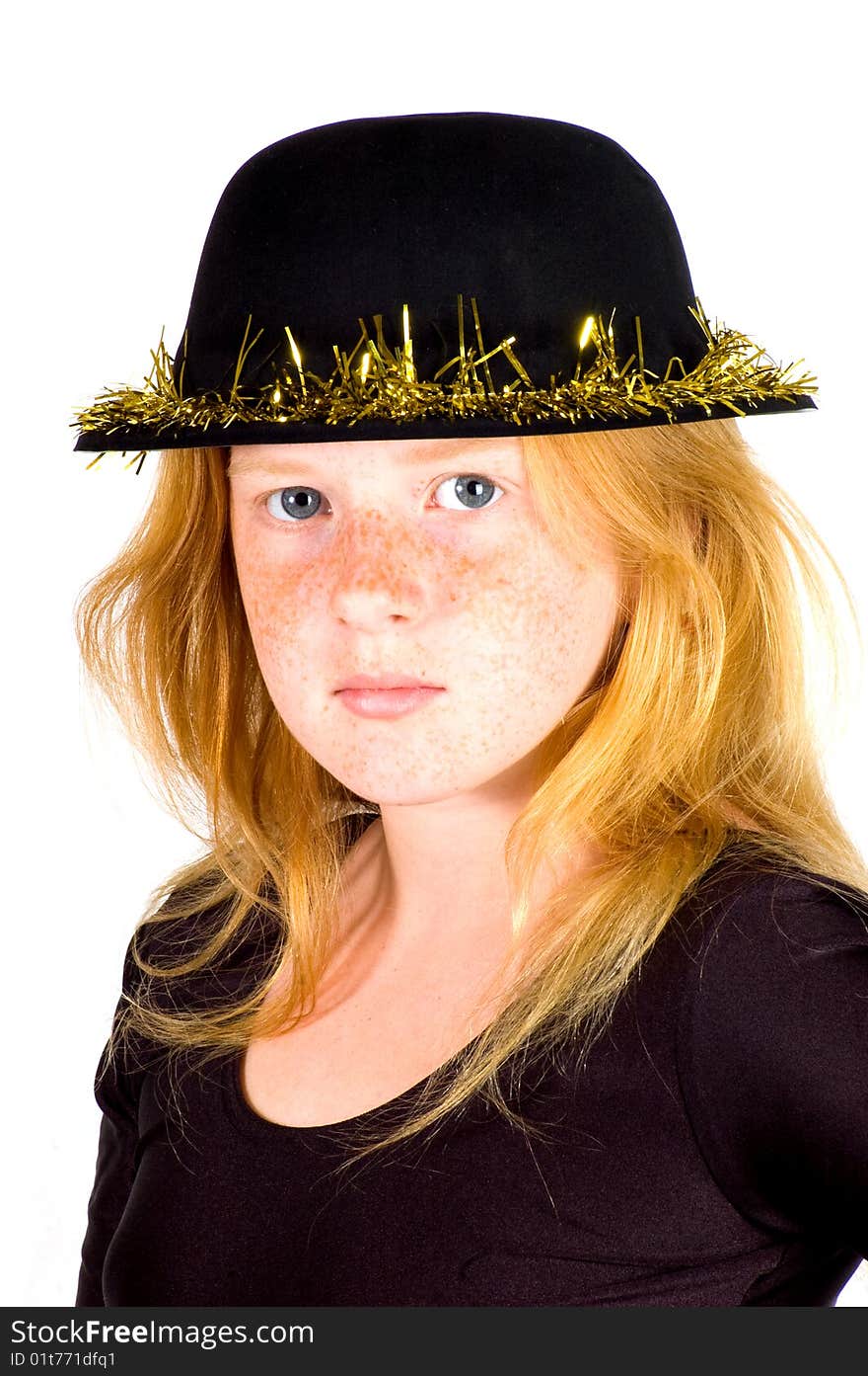 Girl is wearing a black hat with golden streamer