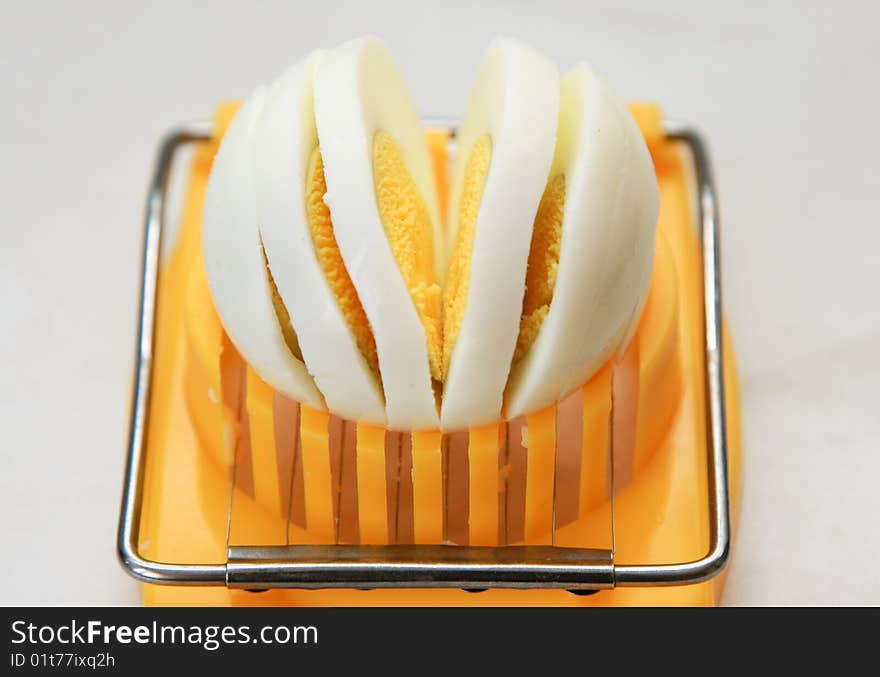 Cutting of boiled egg by egg cutter