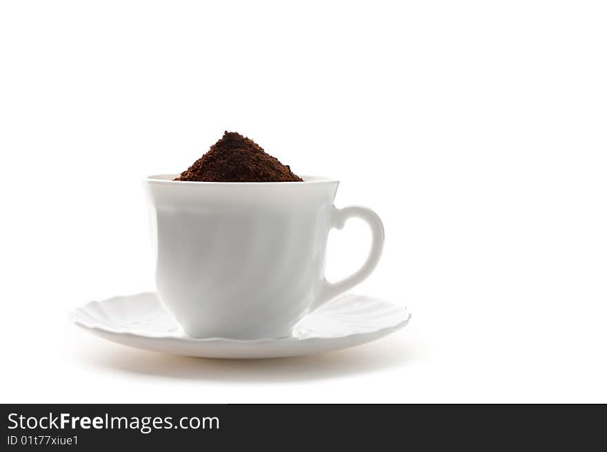 Cup of ground coffee is isolated against a white background. Cup of ground coffee is isolated against a white background