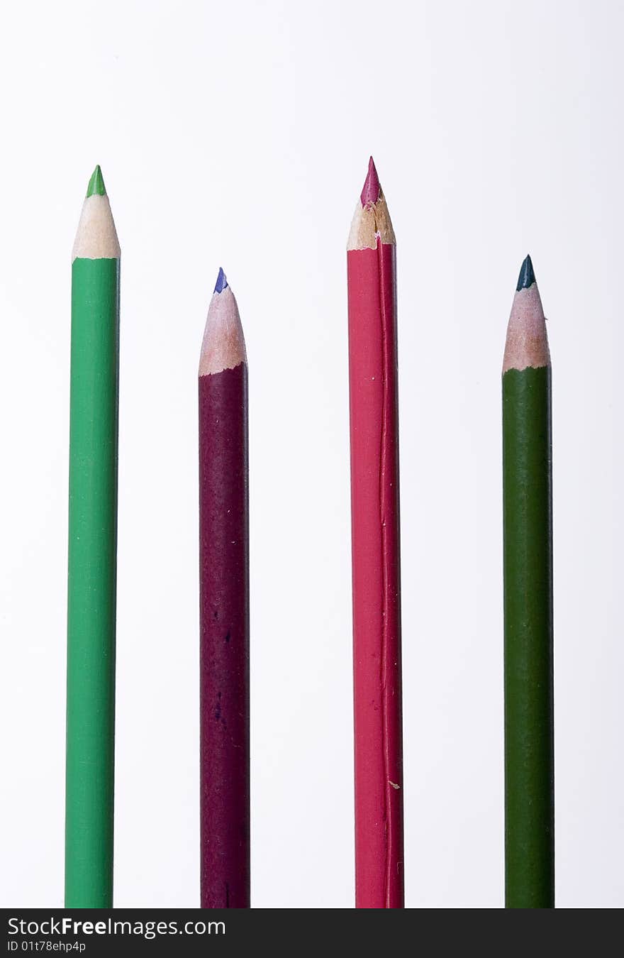 Four coloring pencils against a white background. Four coloring pencils against a white background.