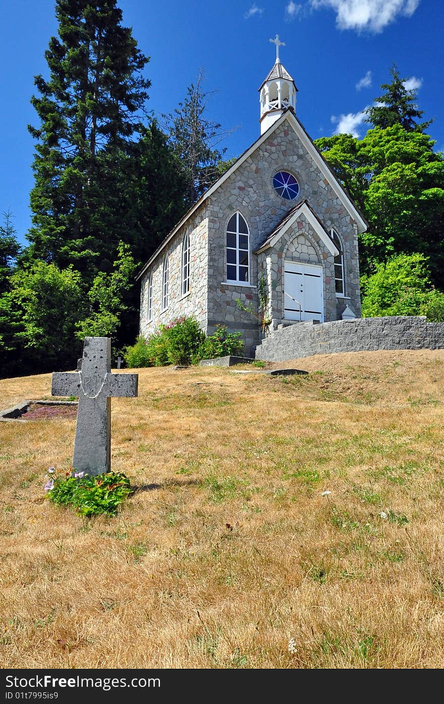 An old stone church sits on a hill on Saltspring Island, Canada. An old stone church sits on a hill on Saltspring Island, Canada