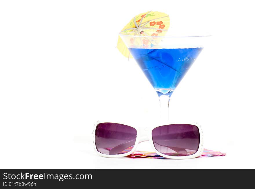 Cocktail on napkin with sunglasses