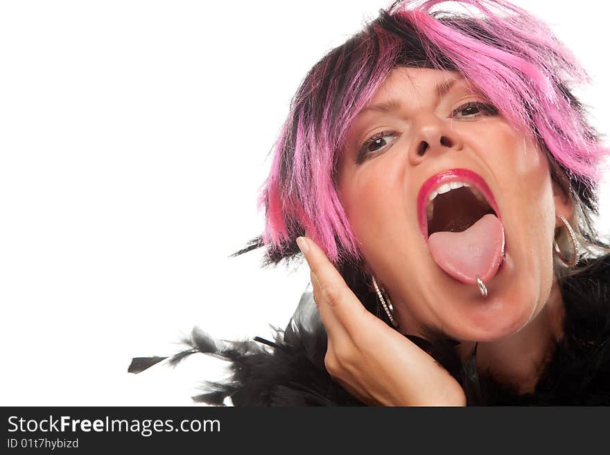 Pink And Black Haired Girl Sticking Her Pierced Tongue Out Isolated on a White Background. Pink And Black Haired Girl Sticking Her Pierced Tongue Out Isolated on a White Background.