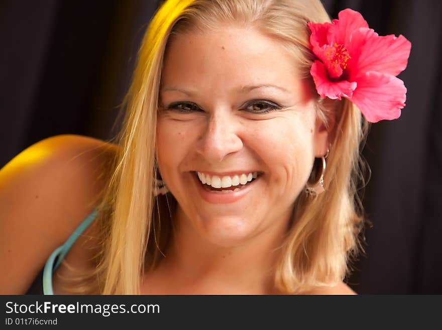 Beautiful Girl With Hibiscus In Her Hair