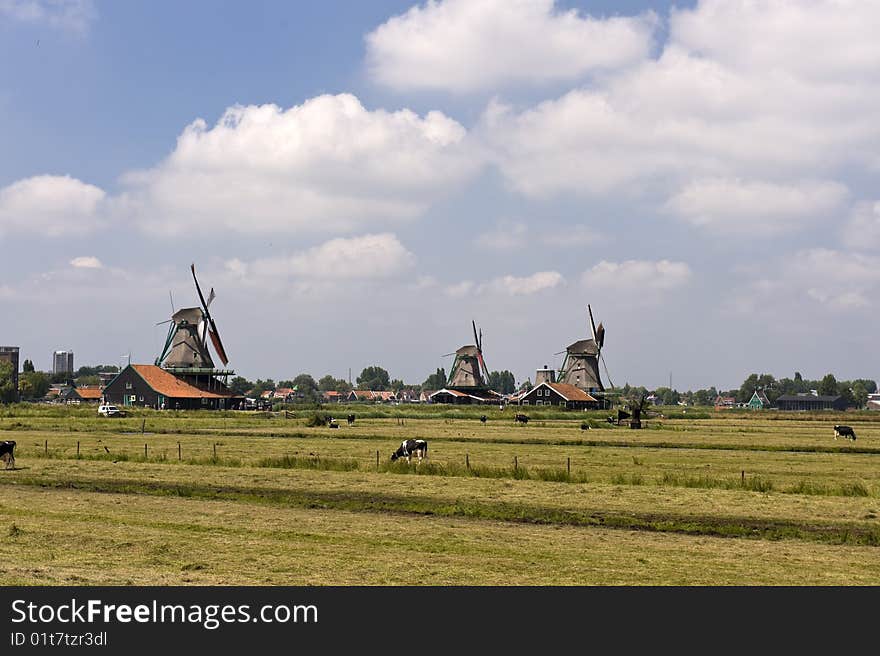 Dutch windmill on a canals edge. Dutch windmill on a canals edge