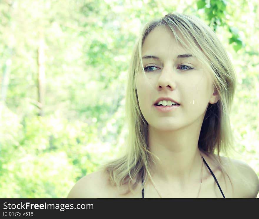 Woman in the green forest