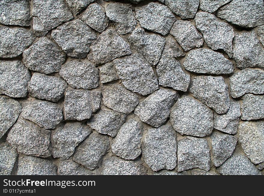 Fragment of an old stone wall