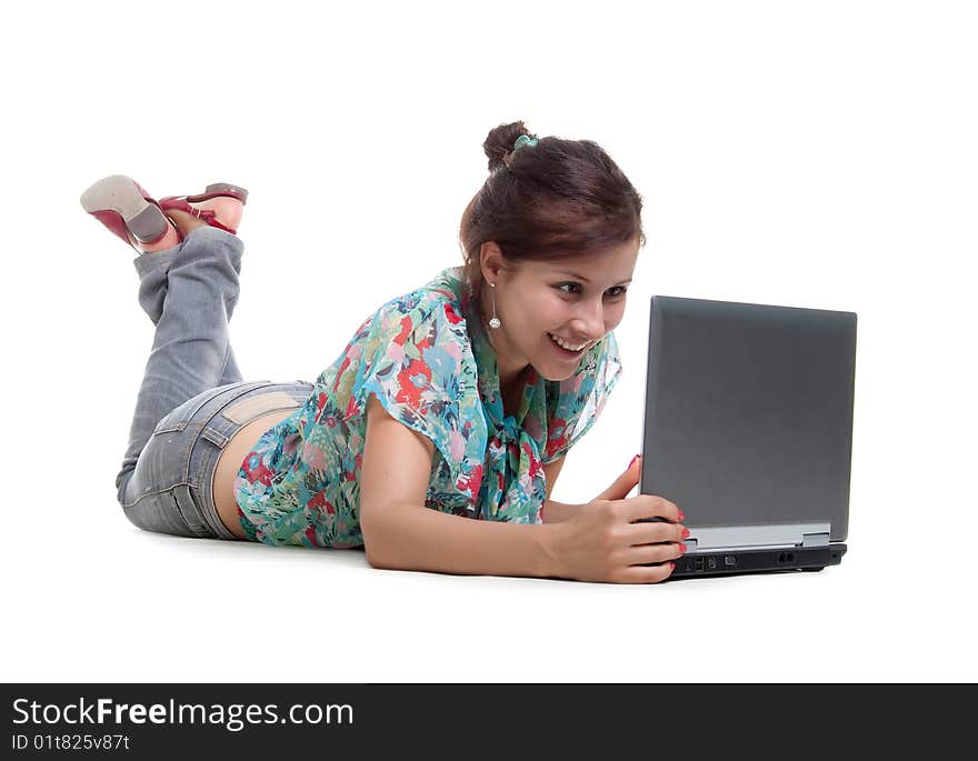 Cute young woman with laptop. Studio shot