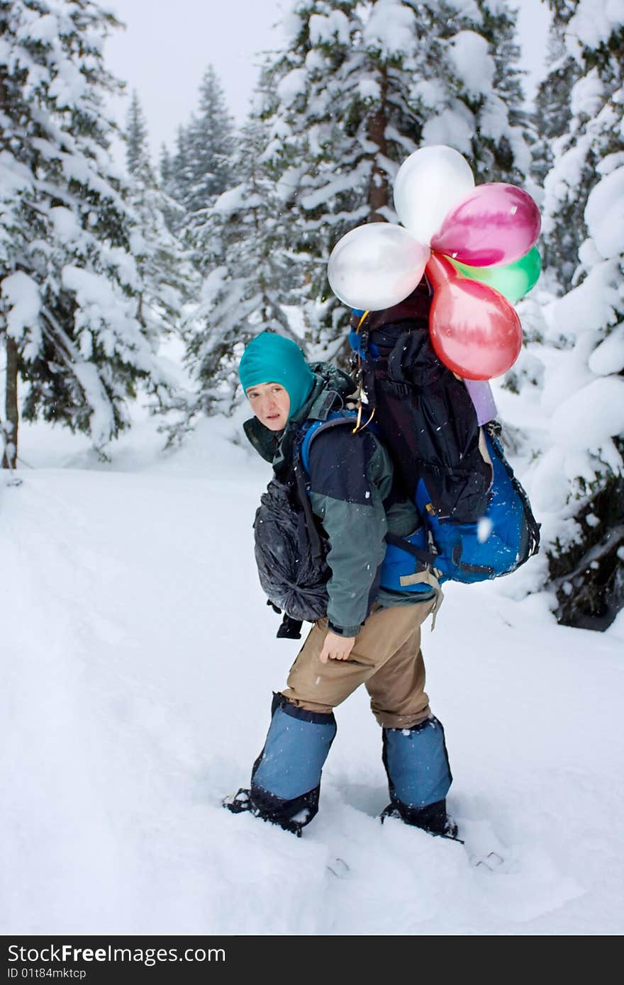 Hiker in winter in mountains