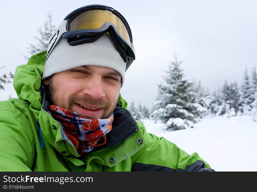 Hiker in winter in mountains