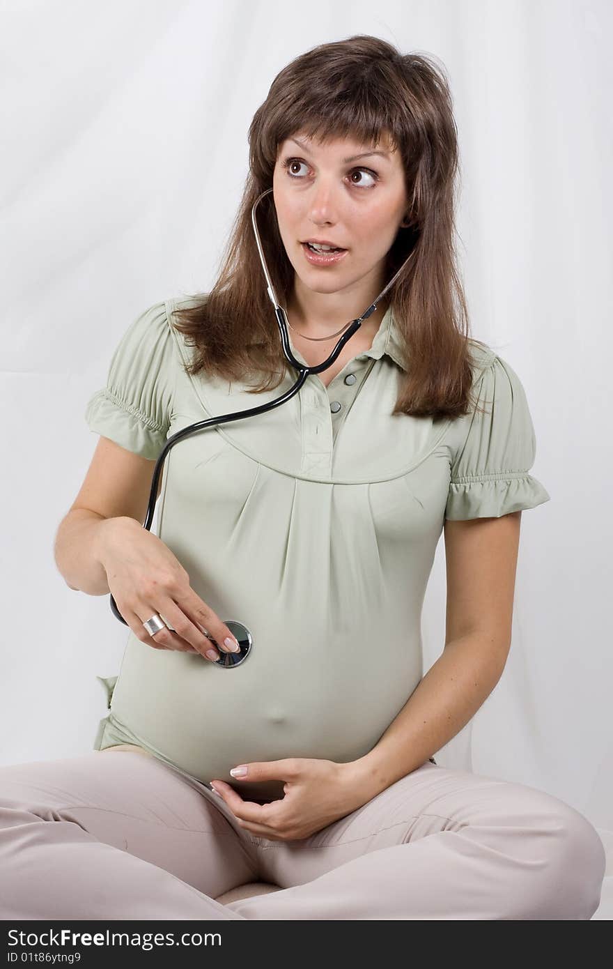 Pregnant female on a white background