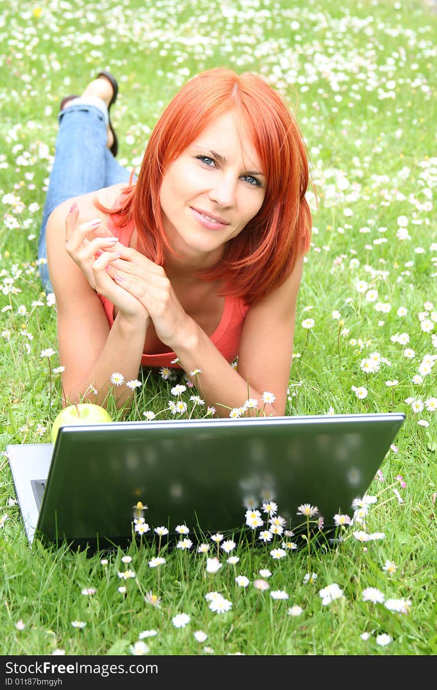 Cute young girl with laptop outdoors. Cute young girl with laptop outdoors