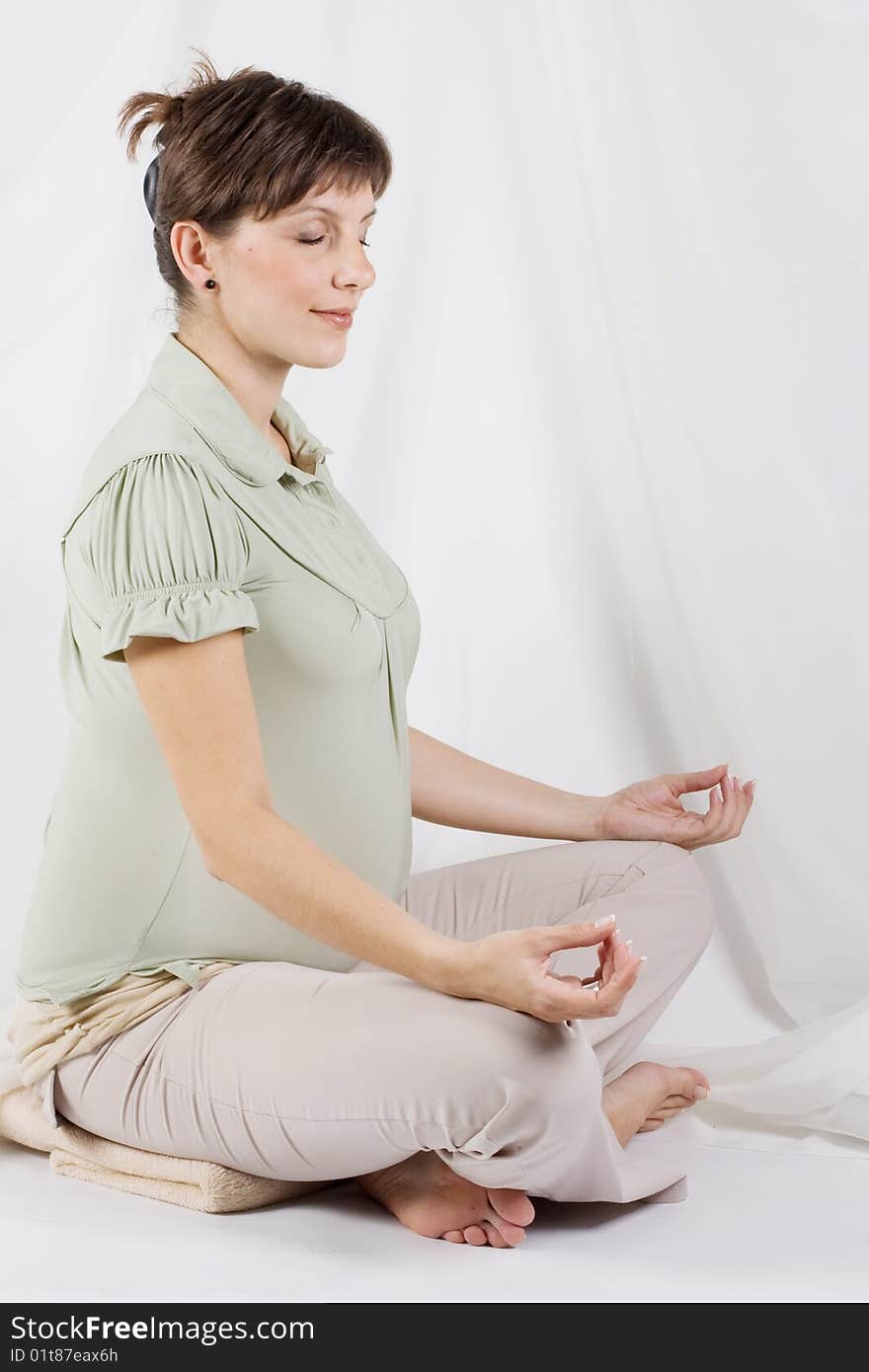 Pregnant female on a white background