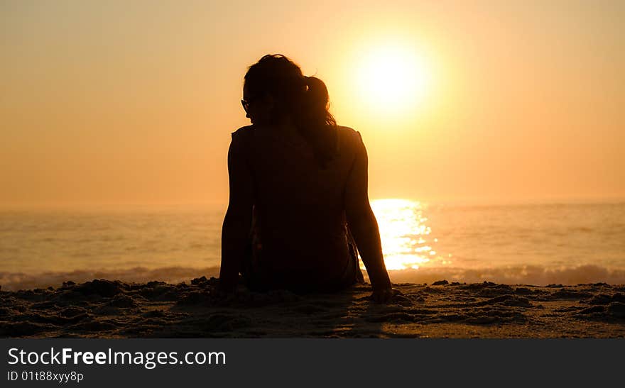 Beautiful girl uses sunglasses to protect her eyes against the harsh morning sun. Beautiful girl uses sunglasses to protect her eyes against the harsh morning sun.