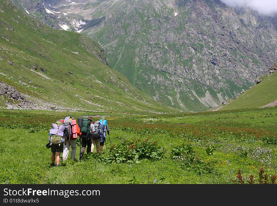 Hikers family in Caucasus mountains