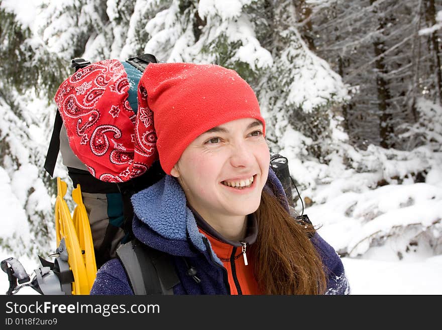 Hiker girl in winter mountains