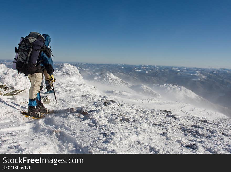 Hiker boy  in winter mountains. Hiker boy  in winter mountains